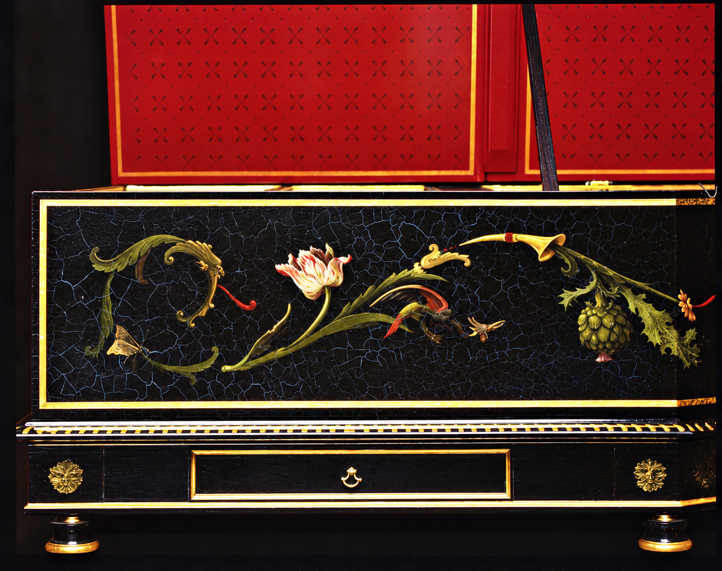 Decorated harpsichord with ornamental baroque painting