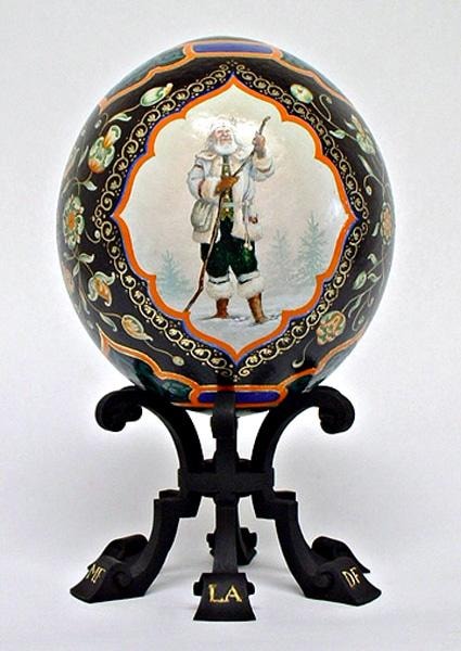 Standing Father Christmas figure in white coat on painted ostrich egg